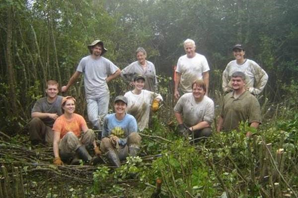 Ceska, front row in blue next to SBG colleague Heather Alley, with GPCA state agency partners and volunteers hand-clearing mountain bog habitat on private land. Photo credit: Anna Yellin, Georgia Dept. of Natural Resources, Wildlife Conservation Section.