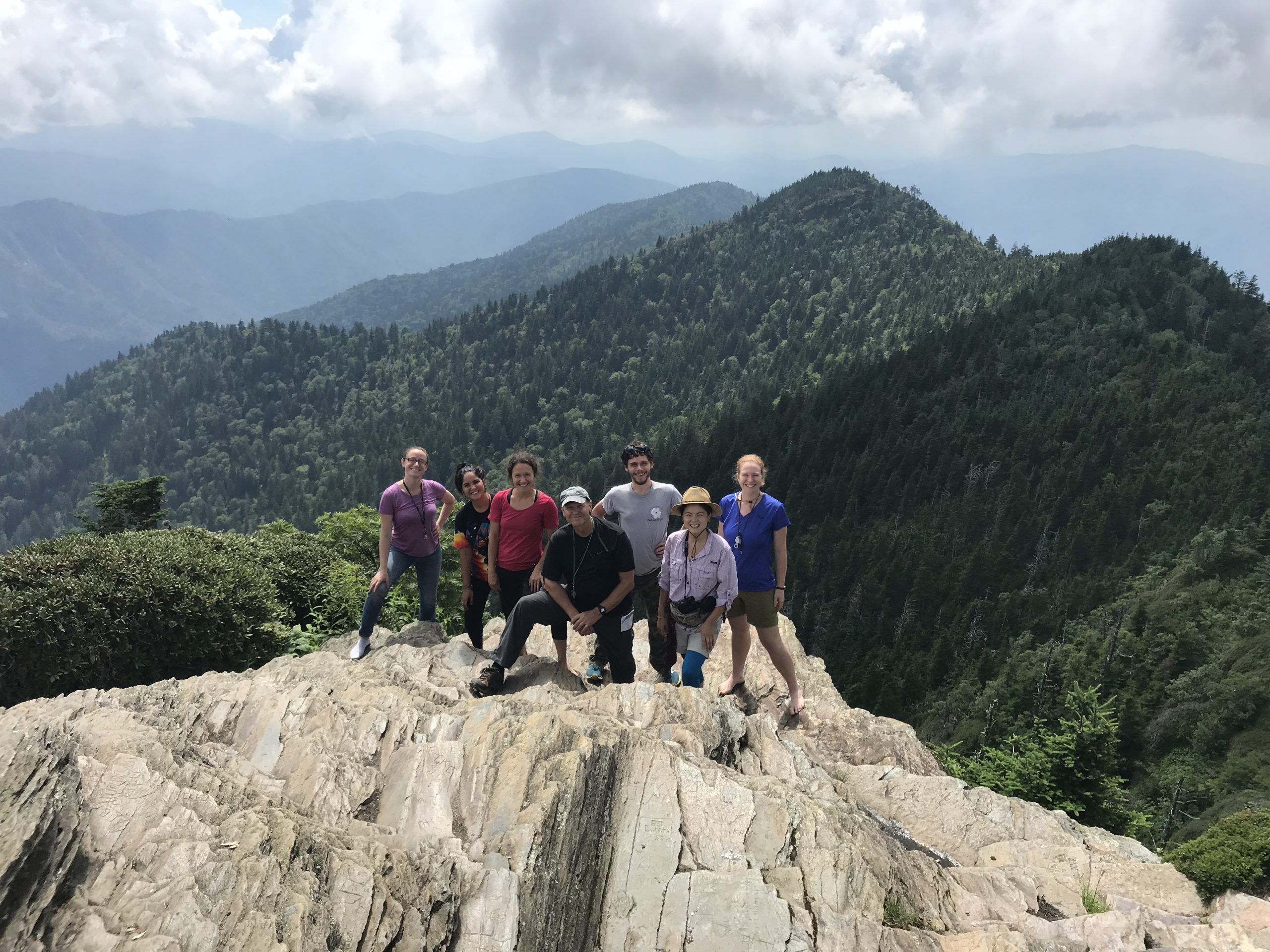 The 2018 Highlands Biological Station field course in introduction to lichens on the culmination of their trip to study threatened endemic species in Great Smoky Mountains National Park. Cliff tops of Mount LeConte, Tennessee.