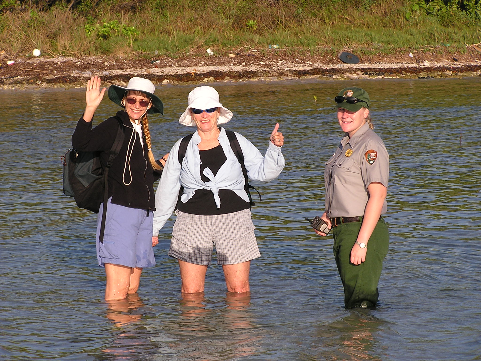 Access to reintroduction sites in Florida sometimes involved wading in shallow waters. Pictured are Joyce Maschinski, Diana Warr and Shelby Moneysmith at Biscayne National Park heading to look for Sargent’s cherry palm.