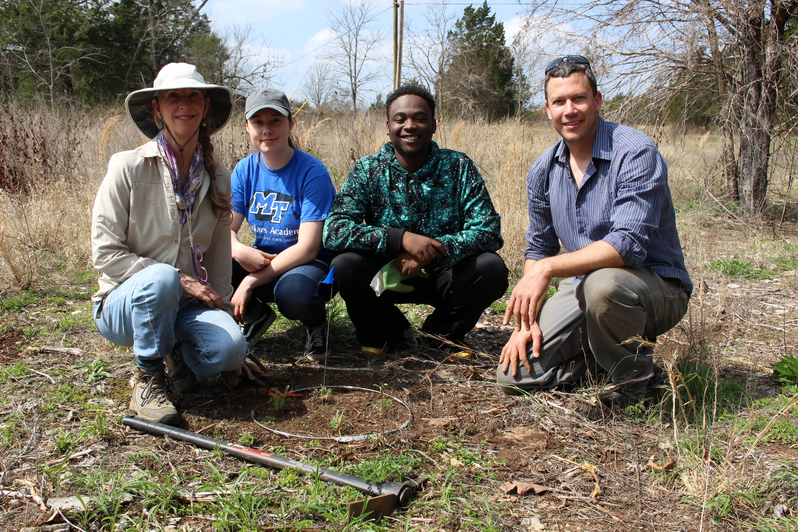 Volunteers join Matthew Albecht in reintroducing Pyne’s ground plum (Astragalus bibullatus).