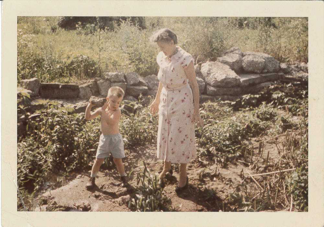 Photo of Spencer Crews spending time with plants and his grandmother, Bernice Crews, who taught him how to grow plants from seed.