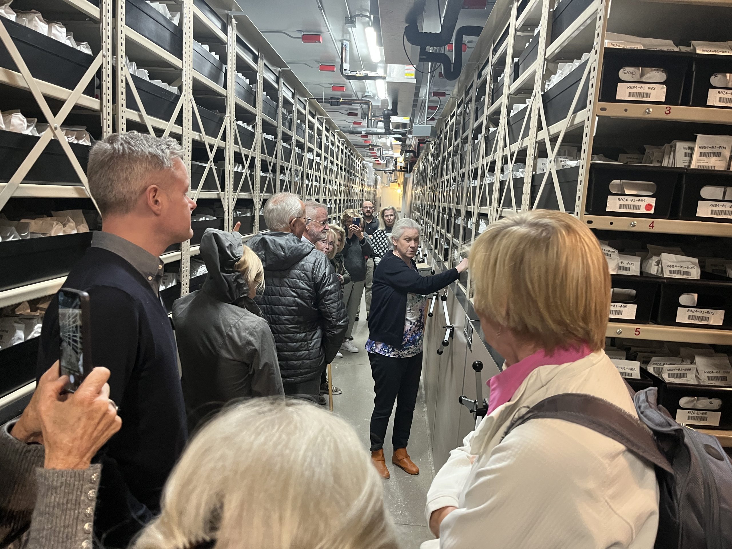 Chris Walters shows CPC Board of Trustees the walk in freezer where USDA seeds are stored. Photo by Katie Heineman.